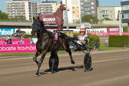 210530 Solvalla - Elitloppet BAHIA QUESNOT with driver Junior Guelpa trotting event at Solvalla track in Stockholm Sweden. High quality photoのeditorial素材