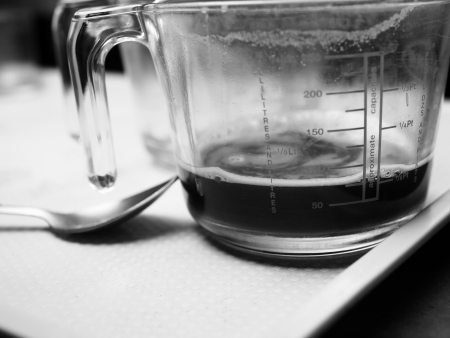 puring espresso coffee to glass, monotone colorの写真素材
