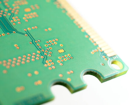 brass electronic circuit on green plateの写真素材
