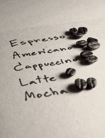 Roasted arabica coffee beans on paper texture with text, retro monotone color backgroundの写真素材