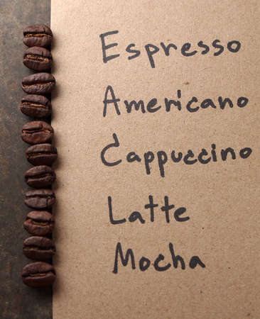 Coffee crop beans with paper on wood texture の写真素材