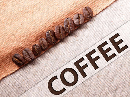 coffee crop beans on fabric textile texture backgroundの写真素材