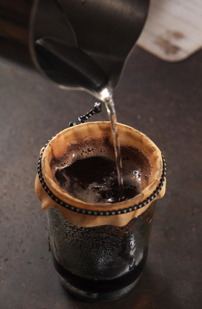 Cup of Dripping fresh hot coffee の写真素材