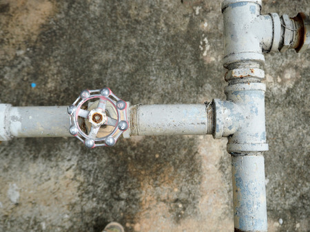 Galvanized steel pipe with tee, elbow, fitting and valve, water piping systemの写真素材