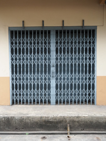 Antique slide steel locked shutter door, texture backgroundの写真素材