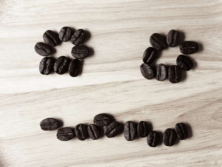 Coffee crop beans on wood texture, monotone color backgroundの写真素材