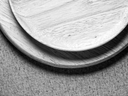 Wood plate on fabric, monotone color backgroundの写真素材