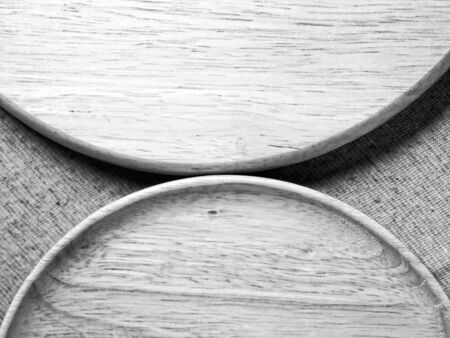 Wood plate on fabric, monotone color backgroundの写真素材