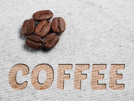Roasted Coffee Beans on fabric textileの写真素材