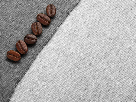 Roasted Coffee Beans on fabric textileの写真素材
