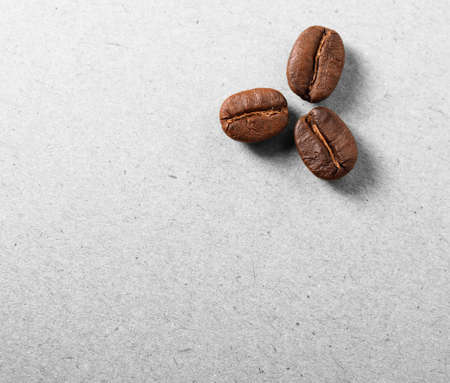 Coffee crop beans on  paper texture backgroundの写真素材