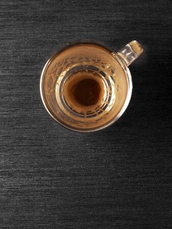 Cup of hot espresso coffee on wood boardの写真素材