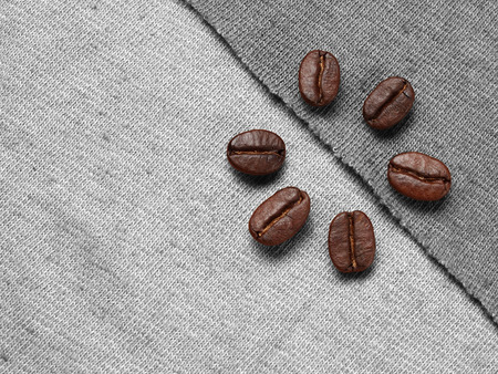 Roasted Coffee Beans on fabric textileの写真素材