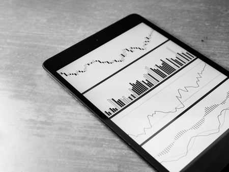 Smartphone Tablet with stock chart investment on screenの写真素材
