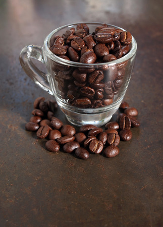 Coffee crop beans in little glass cupの写真素材