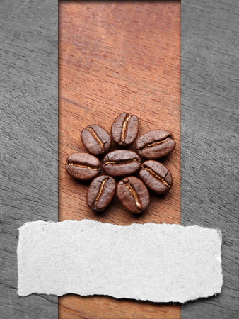 Coffee crop beans with text paper on wood texture backgroundの写真素材