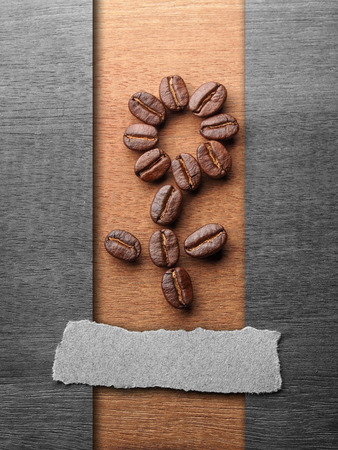 Coffee crop beans with text paper on wood texture backgroundの写真素材
