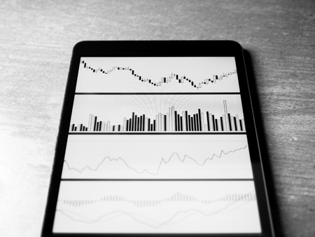 Smartphone Tablet with stock chart investment on screenの写真素材