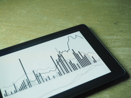 Smartphone Tablet with stock chart investment on screenの写真素材