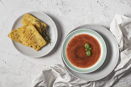 Spicy tomatoes soup with grilled polenta and rosemaryの写真素材
