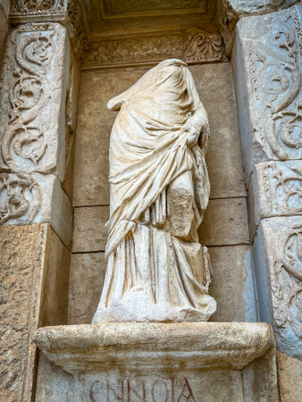 Ennoia statue personifying thought stands veiled in flowing marble drapery within a niche framed by...