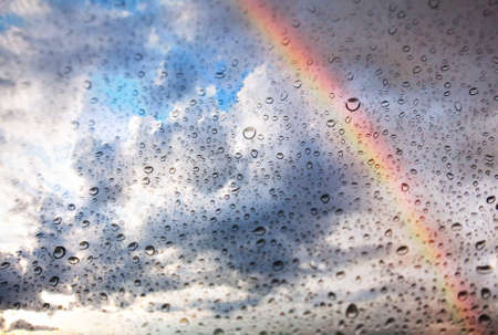 Texture of Rainbow, dramatic sky and water drops on the glassの写真素材