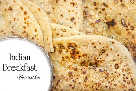 Vegetarian aloo paratha with curd in restaurant in Varkala, Kerala, India. Free space for your text