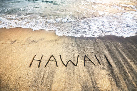 Hawaii title on the sand beach near the oceanの写真素材