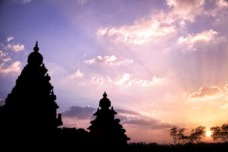 Shore temple silhouette at sunset sky in Mamallapuram, Tamil Nadu, Indiaの写真素材