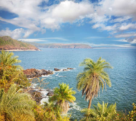 Tropical view to the ocean at blue sky in Gokarna, Karnataka, India