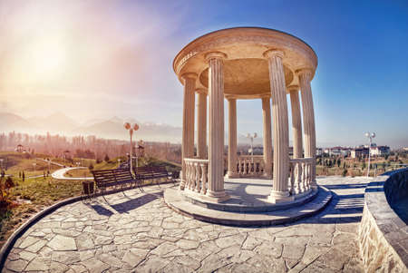 Monument at mountain and blue sky background in dendra park of first president Nursultan Nazarbayev in Almaty, Kazakhstanの写真素材