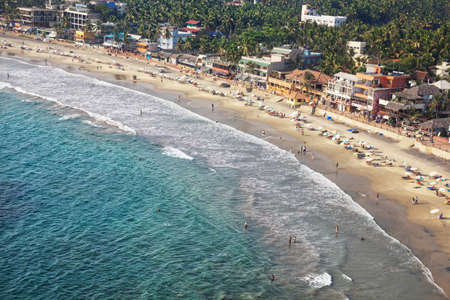 Kovalam, Kerala, INDIA - January 29: View to the beach with tourists, restaurants and hotels from lighthouse in Kovalam on January 29, 2013.のeditorial素材