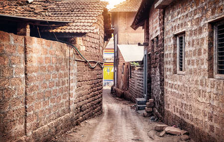 Narrow street and brick houses in Gokarna city, Karnataka, Indiaの写真素材