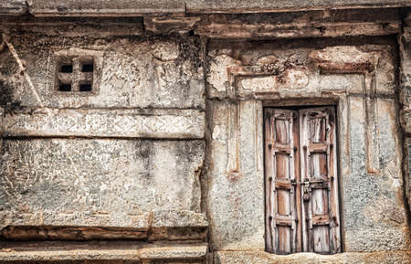 Wooden locked door in old house in Hampi, Karnataka, Indiaの写真素材