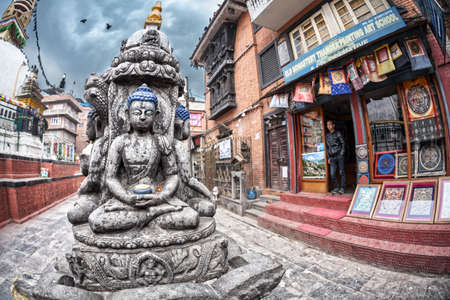 THAMEL, KATHMANDU, NEPAL - APRIL 3, 2014: Buddha statue near tangka painting art school at Kathesimbhu stupaのeditorial素材