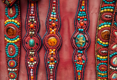 Ethnic Tibetan belts at market near Swayambhunath stupe, Nepalの写真素材