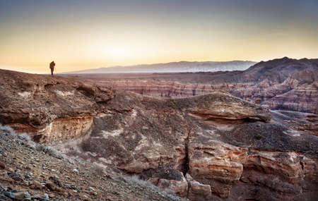 Photographer with tripod at Charyn grand canyon in Kazakhstanの写真素材