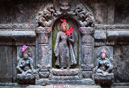 Hindu statues with deities in the temple of Patan, Nepalの写真素材