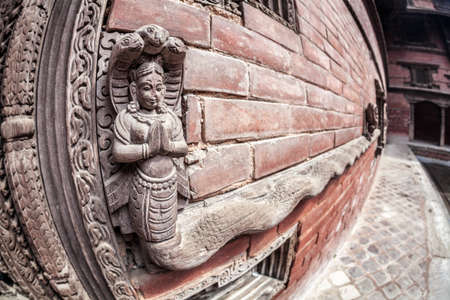 Wooden carved snake Goddess at king palace museum on Durbar square in Kathmandu, Nepalのeditorial素材