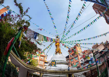 Tahiti Tole Buddhist stupa with prayer flags at blue sky in Thamel, Kathmandu, Nepalのeditorial素材