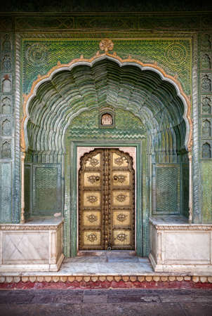 Green gate and golden door in City Palace of Jaipur, Rajasthan, Indiaのeditorial素材