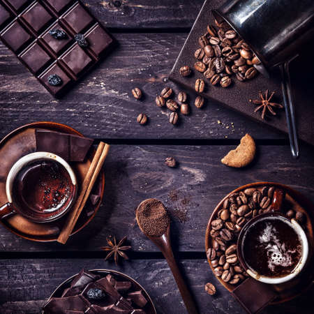 Coffee and dark chocolate with spices on the dark wooden tableの写真素材