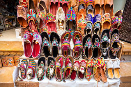 Colorful ethnic shoes on flea market in Indiaの写真素材