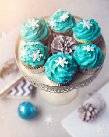Blue cupcakes with snowflakes from the top view in wintertimeの写真素材