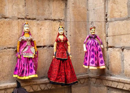 Colorful Rajasthan puppets hanging in the shop of Jaisalmer City Palace, Indiaのeditorial素材