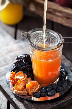 Compote from pumpkin, apples and fry fruits with honey served in Rustic styleの写真素材