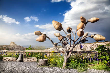 View point in Pigeon valley and tree decorated with pots in Cappadocia, Turkeyの写真素材