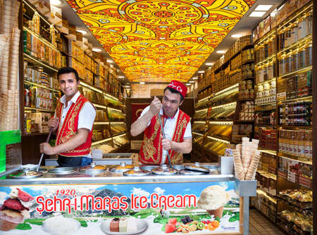 ISTANBUL - MAY 23, 2016 - Young ice-cream sellers in the national red vest in the shop of Sultan...