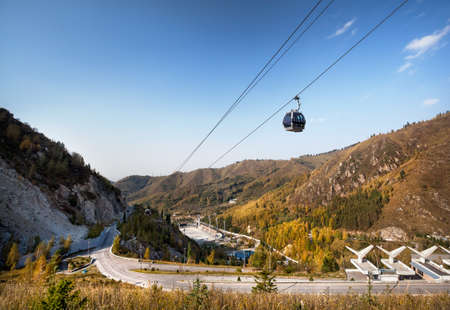 The highest speed skating rink in the world an cable car at autumn time in Almaty, Kazakhstan