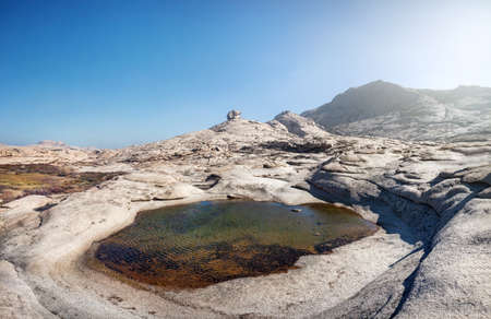 Extinct volcano and small lake in the desert of eastern Kazakhstanの写真素材